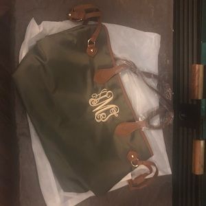 “AMJ” monogram bag.